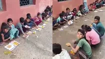 Sheopur Children sitting on the floor in school and eating Mid day meal on pieces of paper instead of plates