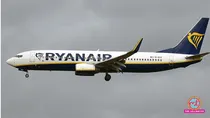ryanair flight emergency landing greece window dislodged passenger partially sucked out