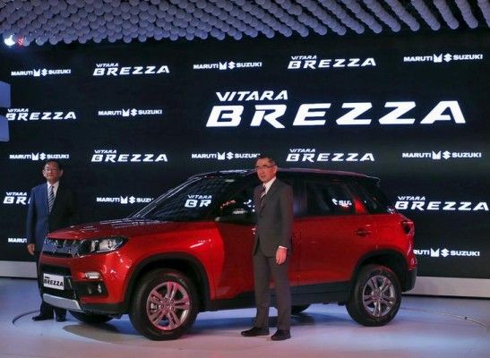 Suzuki Motor's President Toshihiro Suzuki (R) and Kenichi Ayukawa, Managing Director and CEO of Maruti Suzuki India Ltd., pose with their newly launched Brezza car during the Indian Auto Expo in Greater Noida, on the outskirts of New Delhi, India, February 3, 2016. REUTERS/Anindito Mukherjee
