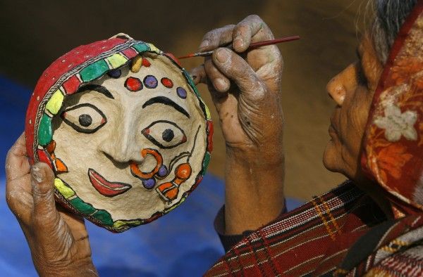 An artisan from Bihar works inside her stall at 22nd Surajkund Crafts Fair in Haryana