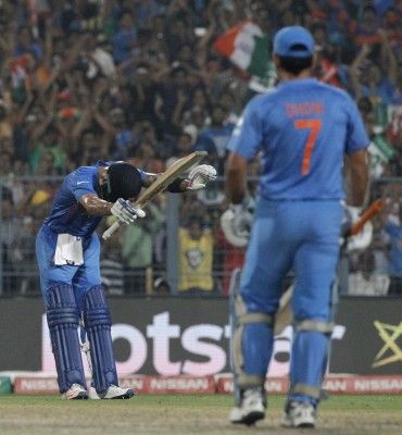 Kohli bowing to Sachin after scoring 50 against Bangladesh