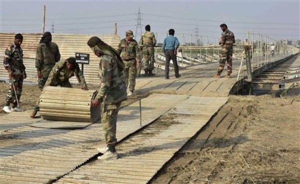New Delhi: Army personnel construct temporary bridges over Yamuna river for the three-day World Peace Festival organised by spiritual guru Sri Sri Ravi Shankar in New Delhi on Tuesday. PTI Photo by Kamal Kishore (PTI3_8_2016_000261A)