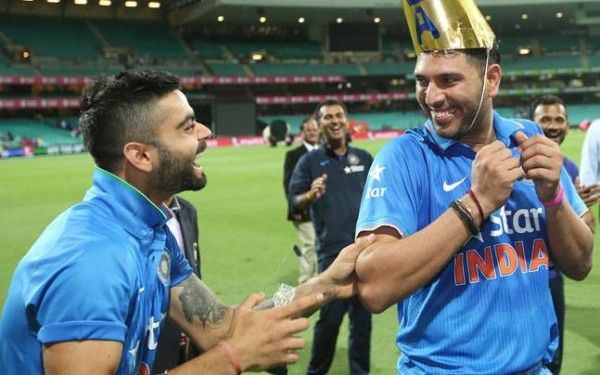 Kohli and Yuvraj sharing light moments