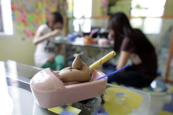 An ice-cream is displayed at a toilet-themed restaurant in Beijing. September 9, 2009. The restaurant, one of its kind in Beijing since its opening in June, 2009, is decorated entirely with toilet items, customers sit on toilet seats and food is served in miniature toilet bowls and bathtubs . REUTERS/Nir Elias (CHINA SOCIETY ODDLY)
