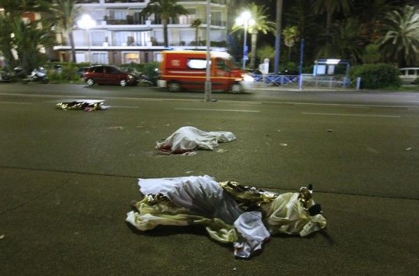 Bodies are seen on the ground after at least 30 people were killed in the southern French town of Nice when a truck ran into a crowd celebrating the Bastille Day national holiday