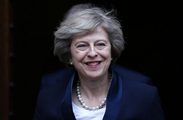 Theresa May emerges to speak to reporters after being confirmed as the leader of the Conservative Party and Britain's next Prime Minister outside the Houses of Parliament in Westminster, central London