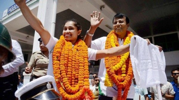 घर वापसी के बाद दीपा अपने कोच के साथ. PTI