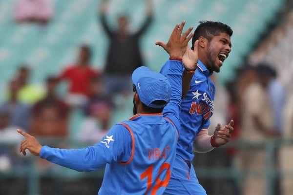 India's Umesh Yadav, right, and Virat Kohli celebrate the dismissal of New Zealand's Ross Taylor during their first one-day international cricket match in Dharmsala, India, Sunday, Oct. 16, 2016. (AP Photo/Tsering Topgyal)