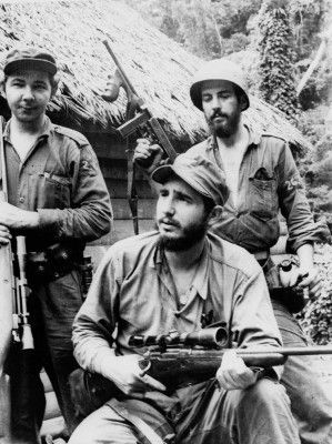 FILE - In this March 14, 1957 file photo, Fidel Castro, the young anti-Batista guerrilla leader, center, is seen with his brother Raul Castro, left, and Camilo Cienfuegos, right, while operating in the Mountains of Eastern Cuba. Cuban President Raul Castro has announced the death of his brother Fidel Castro at age 90 on Cuban state media on Friday, Nov. 25, 2016.&nbsp;(AP Photo/Andrew St. George, File)
