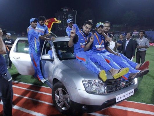India's Kohli, Tiwary and Pathan celebrate on a jeep after winning the final ODI match and the series against Sri Lanka in Pallekele