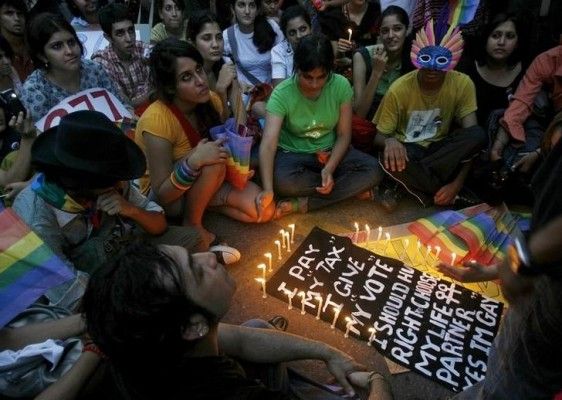 Gay rights activists listen to a speaker during "Queer Pride March" in New Delhi June 29, 2008. Hundreds of gay activists on Sunday took part in the march to raise awareness about their rights. REUTERS/Adnan Abidi (INDIA)
