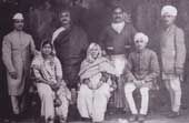 photograph of Allama Iqbal’s Kashmiri Brahmin family taken in Sialkot in 1931. At this time Iqbal was in his mid-fifties. He had already risen to the top as the greatest Urdu poet, at par with Mirza Asadullah Khan Ghalib. Although he was proud of his Brahmin descent, he had nothing to say about his Hindu relations. In this picture, the elderly lady seated in the middle is his grandmother, Indirani Sapru, nicknamed Poshi, wife of Pandit Kanhaya Lal Sapru. The man standing on the left in a shawl is Iqbal’s cousin, Amarnath Sapru