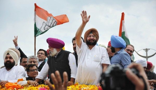 Former Punjab CM and Congress candidate from Amritsar Capt. Amrinder Singh with his supporters during his road show in Amritsar on Friday. Photo By Prabhjot Gill