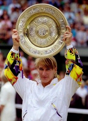 Germany's Steffi Graf holds aloft the winner's trophy after victory in the 100th Wimbledon Ladies' Singles final July 3rd