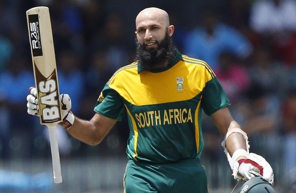 South Africa's Amla raises his bat as he celebrates his century during their first One Day International cricket match against Sri Lanka in Colombo