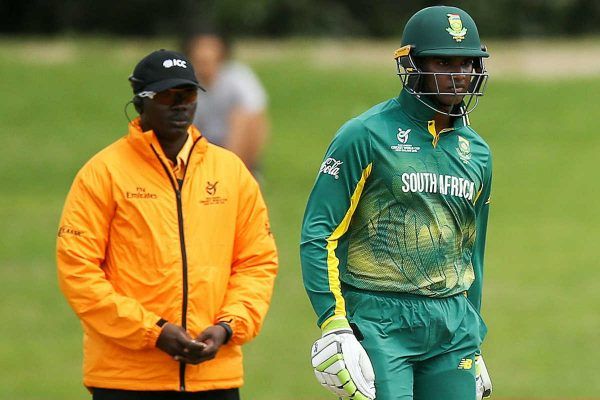 Jarion-Hoyte-of-the-West-Indies-bowls-while-Jiveshan-Pillay-of-South-Africa-looks-on-600x400