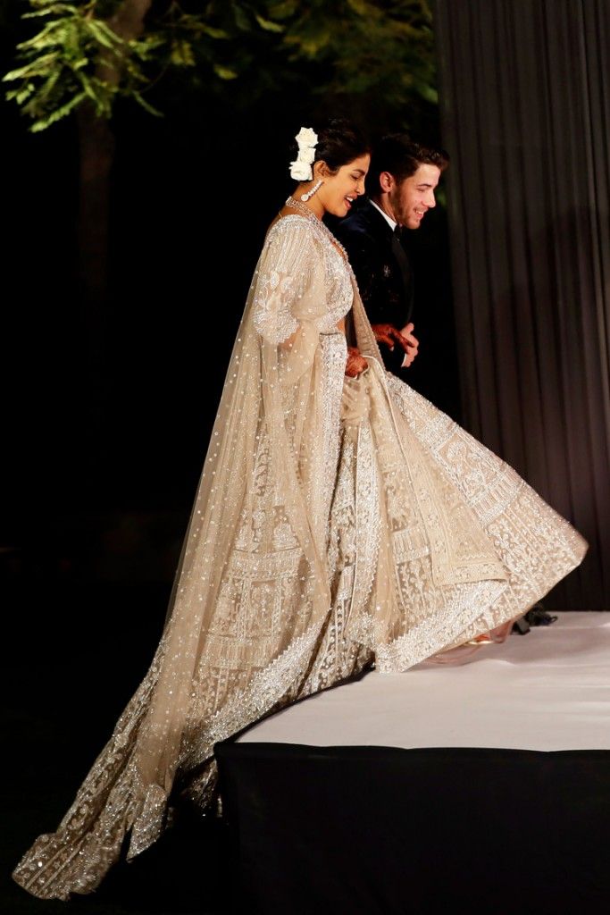 Mandatory Credit: Photo by Altaf Qadri/AP/REX/Shutterstock (10013599h) Priyanka Chopra, Nick Jonas. Bollywood actress Priyanka Chopra and musician Nick Jonas arrive for their wedding reception in New Delhi, India Chopra Jonas Wedding, New Delhi, India - 04 Dec 2018