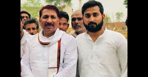 विधायक के साथ आरोपी पुत्र राहुल.