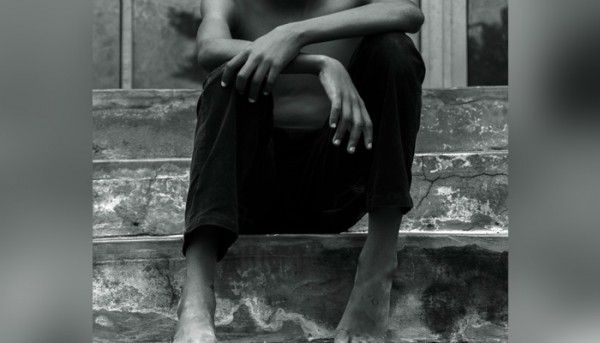 Grayscale Photo Of Boy Sitting On Stair 1328404