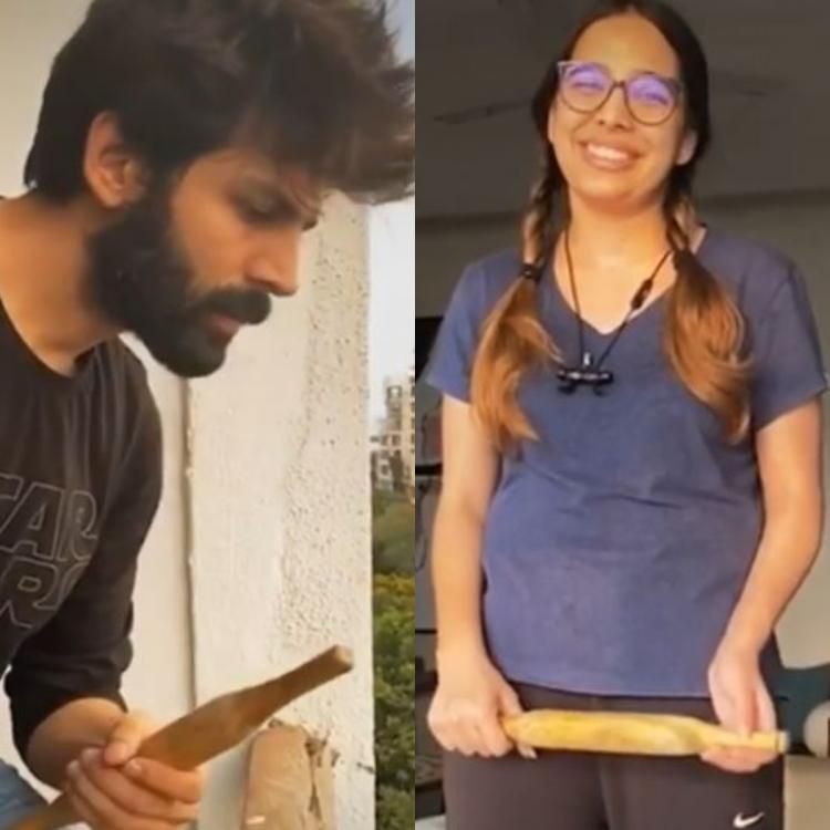 बाल से खिंचने के बाद बेलन लेकर अपनी बहन को धमकाते कार्तिक.