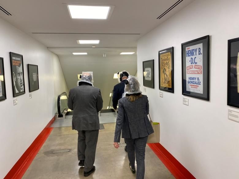 People Wearing Gas Masks Walk Inside The Capitol Building, January 6. Twitter:@repdavidtrone