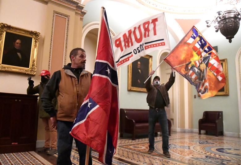 Pro Trump Protesters Wave Banners During Clashes With Capitol Police, January 6. Reuters:shannon Stapleton 2