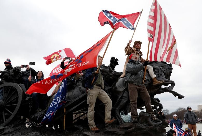 Pro Trump Protesters Wave Banners During Clashes With Capitol Police, January 6. Reuters:shannon Stapleton