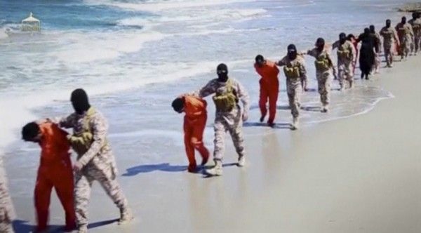 Islamic State militants lead what are said to be Ethiopian Christians along a beach in Wilayat Barqa, in this still image from an undated video made available on a social media website